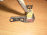 Датчик удара Toyota Vitz NCP10 перед, лев 89174-52010