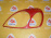Накладка на фару Toyota Vitz NCP10 перед, лев 08424-52010 (Красный)