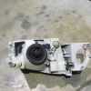 Фара Mazda лев Familia BJ5W '1998-2000