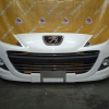 Бампер Peugeot 207 A7 '2009-2013 перед в сборе (туманки)