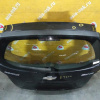 Дверь задняя Chevrolet Aveo T300 '2011-2016 спойлер (дефект, вмятина слева и сверху, сломана накладка)