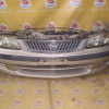 Ноускат Nissan Sunny B15 QG '1998-2002 a/t (без габаритов) трещины стекла R фары ф.1602