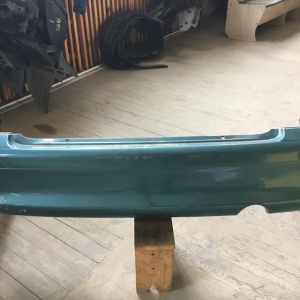 Бампер Mazda Capella GF8P '2000-2002 зад sedan (сонары)