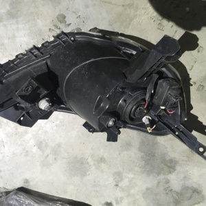 Фара NISSAN лев Y12 деф.крепл