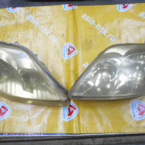Фара TOYOTA 100-77486 Corolla NZE120 '2001-2004 прав+лев (пара) (ЕВРОСВЕТ) Дефект крепления фар/