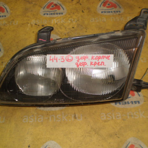 Фара TOYOTA 44-11/44-3 лев Ipsum SXM10 '1996-1998 Дефект крепления Дефект корпуса
