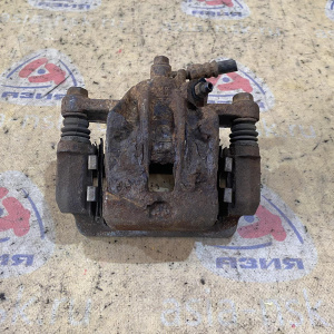 Суппорт Kia KM/JE/FQ Sportage зад, лев 582102E000 '2005