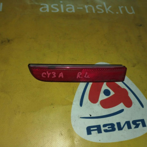 Отражатель в бампер Mitsubishi Lancer CY4A зад, лев 1197-229