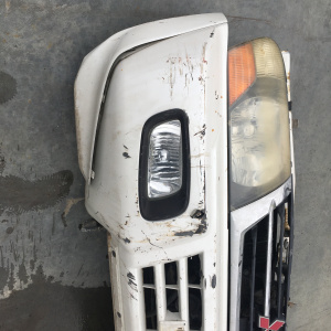 Ноускат Mitsubishi Pajero V75W '1999-2003 Без радиатора охлаждения Дефект бампера ф.100-87419 тум.P0239